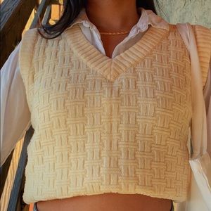 yellow sweater vest